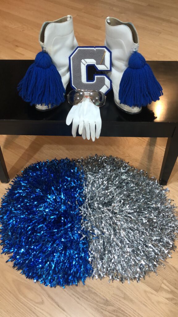 photo of marching band boots and pom poms