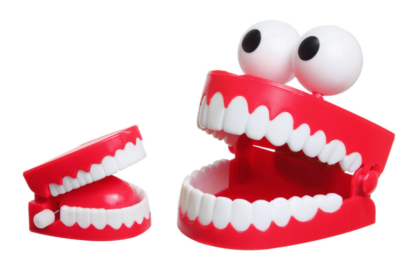 photo of Chattering Plastic Teeth on White Background