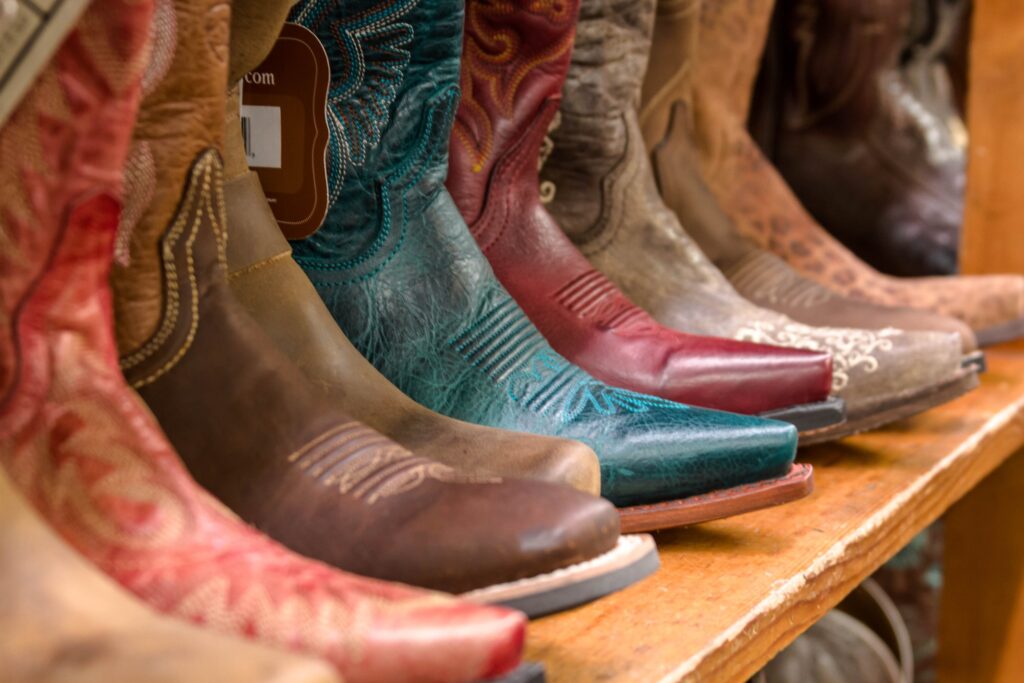 photo of a shelf of colorful boots